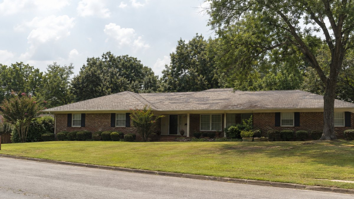 Aging shingle roof under a hot Mid-South sky